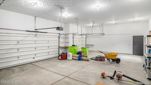 5305 Fern Dr, Fenton, MI 48430 - garage with a garage door opener