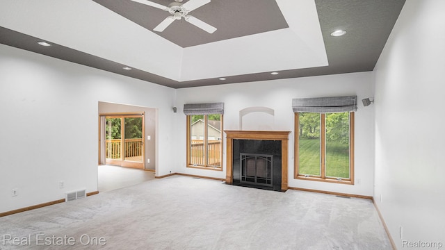 5305 Fern Dr, Fenton, MI 48430 - unfurnished living room featuring carpet flooring, baseboards, a fireplace with flush hearth, a ceiling fan, and recessed lighting