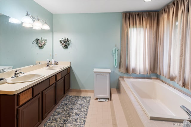 295 Oakbridge Dr, Rochester, MI 48306 - full bathroom featuring a garden tub, double vanity, baseboards, and tile patterned floors