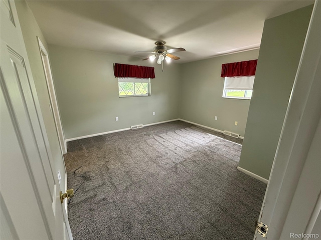 7145 Morrish Rd, Swartz Creek, MI 48473 - carpeted empty room with plenty of natural light, a ceiling fan, and baseboards