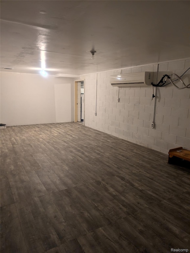7145 Morrish Rd, Swartz Creek, MI 48473 - finished basement featuring dark wood-style floors and concrete block wall
