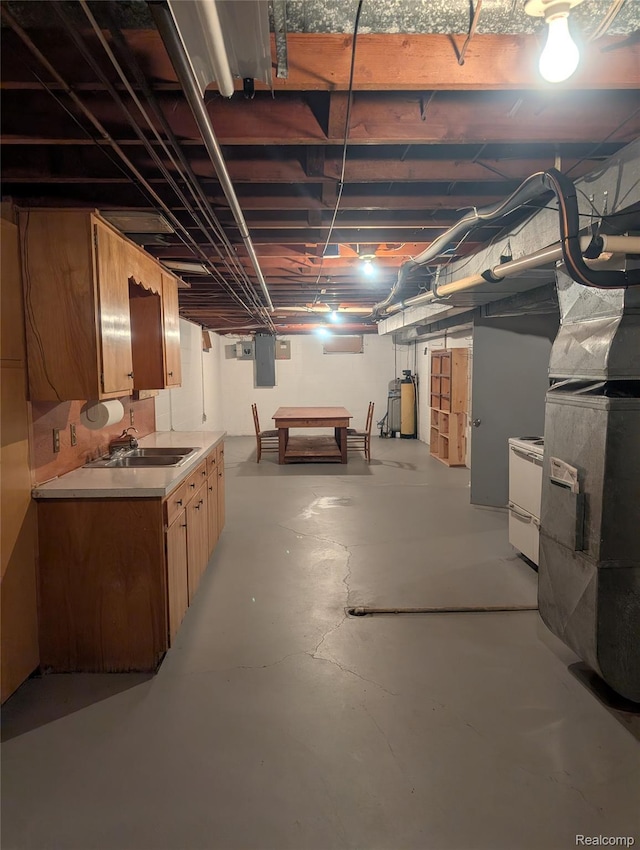 7145 Morrish Rd, Swartz Creek, MI 48473 - unfinished basement featuring a sink, heating unit, electric panel, and washer / clothes dryer