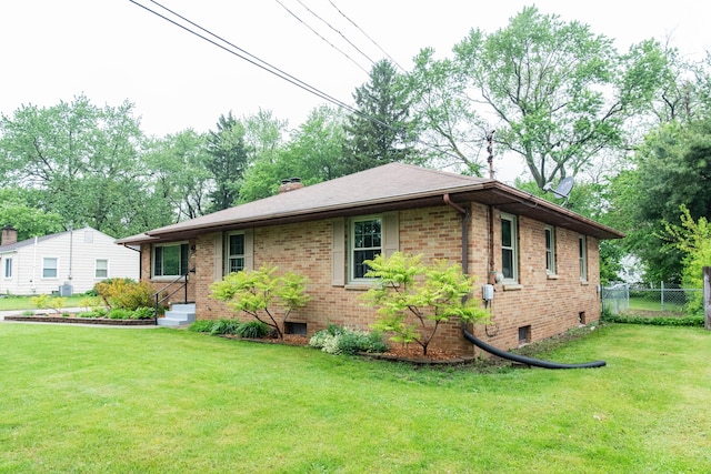 1419 Vassar Dr, Kalamazoo, MI 49001 - view of front of house with brick siding and a chimney