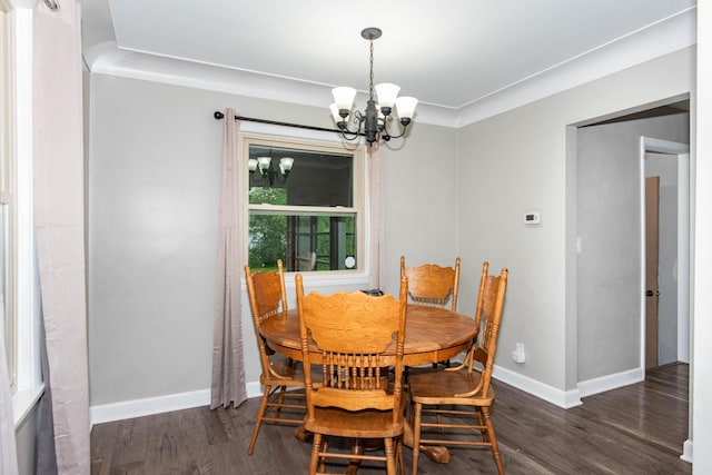1419 Vassar Dr, Kalamazoo, MI 49001 - dining space featuring a chandelier, wood finished floors, and baseboards