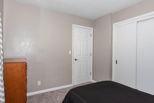 1419 Vassar Dr, Kalamazoo, MI 49001 - carpeted bedroom featuring baseboards and a closet