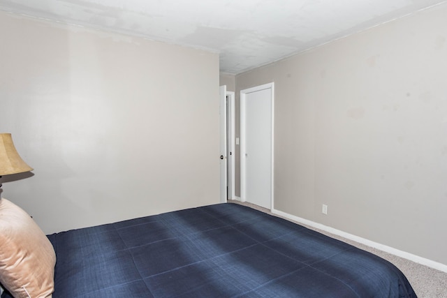 1419 Vassar Dr, Kalamazoo, MI 49001 - unfurnished bedroom with dark colored carpet