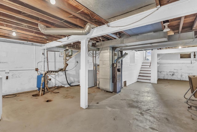 870 Bryant Ave, Jackson, MI 49202 - unfinished below grade area featuring heating unit and stairs