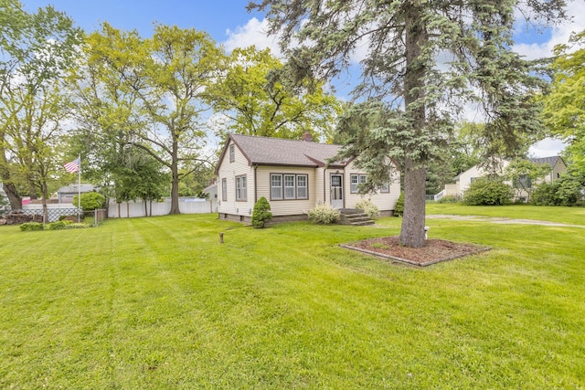 870 Bryant Ave, Jackson, MI 49202 - view of front facade featuring a chimney and a shingled roof