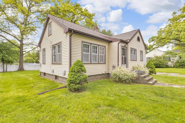 870 Bryant Ave, Jackson, MI 49202 - bungalow-style house with a chimney and roof with shingles