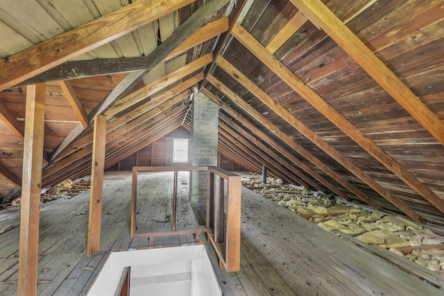 870 Bryant Ave, Jackson, MI 49202 - attic featuring an upstairs landing