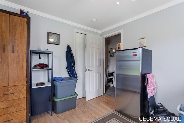 1070 Morningside St, Muskegon, MI 49442 - misc room featuring light wood finished floors and ornamental molding