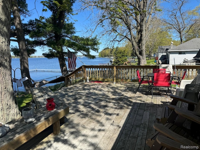 6111 Loud Dr, Oscoda, MI 48750 - wooden deck featuring a water view