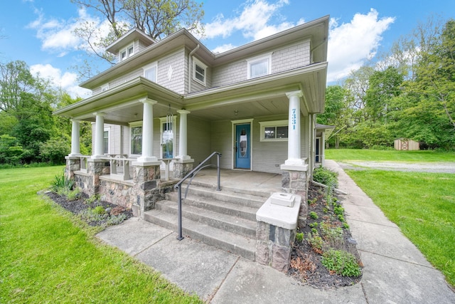 7331 Browns Lake Rd, Jackson, MI 49201 - view of front facade with a porch and a front yard