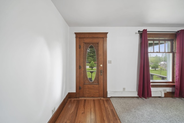 7331 Browns Lake Rd, Jackson, MI 49201 - foyer entrance featuring wood finished floors, baseboards, and baseboard heating