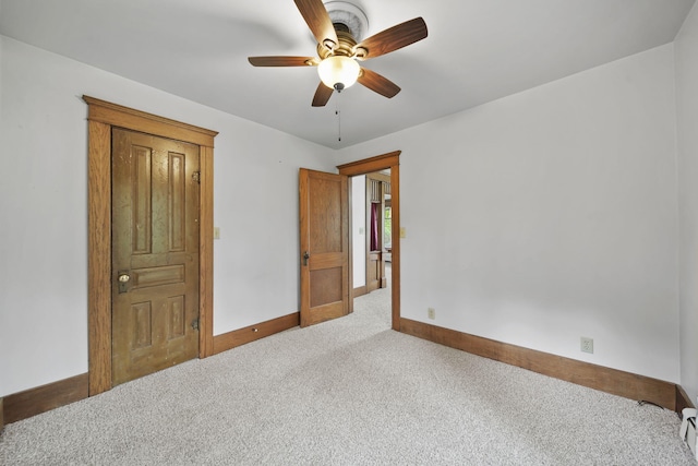 7331 Browns Lake Rd, Jackson, MI 49201 - empty room featuring carpet, baseboards, a ceiling fan, and baseboard heating
