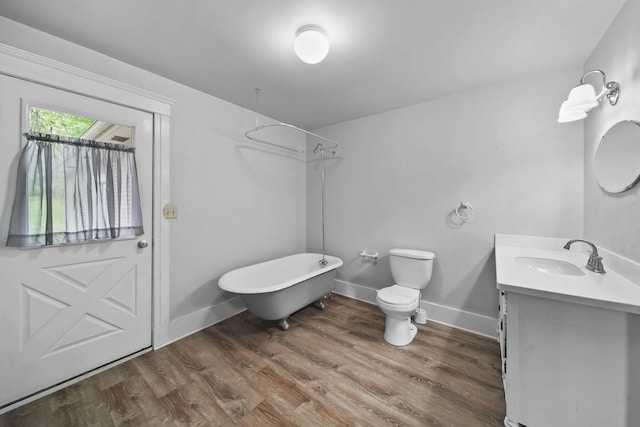 7331 Browns Lake Rd, Jackson, MI 49201 - bathroom featuring vanity, wood finished floors, toilet, and baseboards