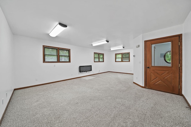 7331 Browns Lake Rd, Jackson, MI 49201 - carpeted empty room with baseboards and a wall mounted AC