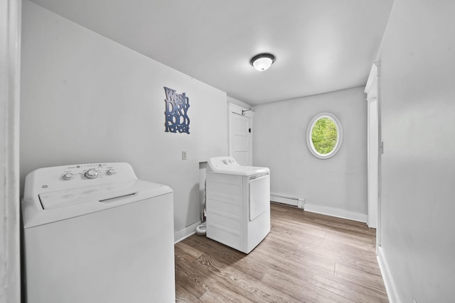 7331 Browns Lake Rd, Jackson, MI 49201 - laundry room featuring washing machine and dryer, a baseboard heating unit, wood finished floors, and baseboards