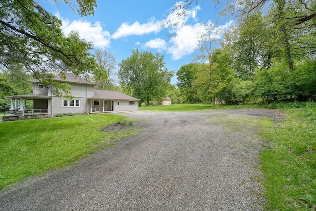 7331 Browns Lake Rd, Jackson, MI 49201 - view of front of house featuring driveway and a front lawn