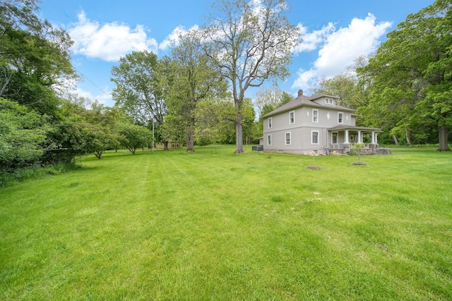 7331 Browns Lake Rd, Jackson, MI 49201 - view of grassy yard featuring covered porch