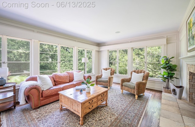 3320 Morningview Ter, Bloomfield Hills, MI 48301 - living room with ornamental molding, plenty of natural light, a fireplace, and a decorative wall