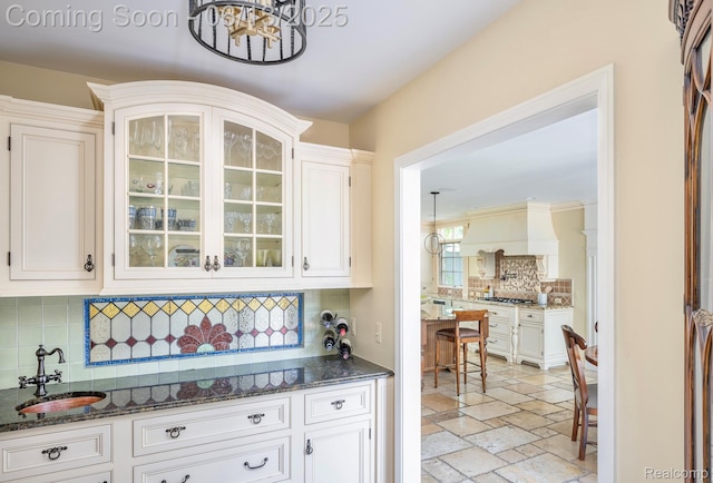 3320 Morningview Ter, Bloomfield Hills, MI 48301 - kitchen with decorative backsplash, a chandelier, white cabinets, and glass insert cabinets