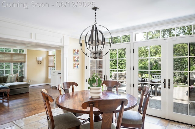 3320 Morningview Ter, Bloomfield Hills, MI 48301 - dining space featuring a chandelier, french doors, crown molding, and stone tile floors