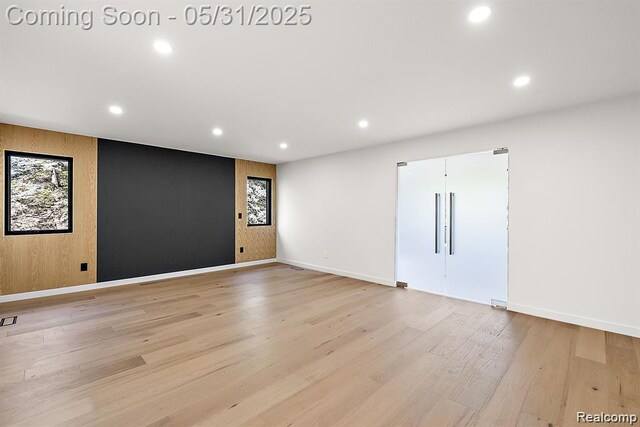 1367 W Long Lake Rd, Bloomfield Hills, MI 48302 - empty room with recessed lighting, light wood-style floors, plenty of natural light, and baseboards