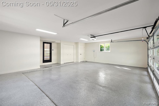 1367 W Long Lake Rd, Bloomfield Hills, MI 48302 - garage with a garage door opener and baseboards