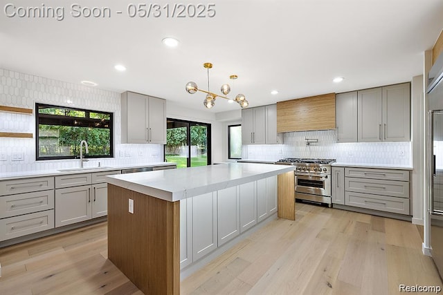 1367 W Long Lake Rd, Bloomfield Hills, MI 48302 - kitchen with high end stove, gray cabinets, custom range hood, and recessed lighting
