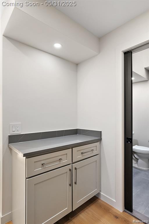 1367 W Long Lake Rd, Bloomfield Hills, MI 48302 - detailed view of wood finished floors, baseboards, and recessed lighting