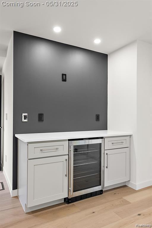 1367 W Long Lake Rd, Bloomfield Hills, MI 48302 - bar area featuring beverage cooler, light wood-style flooring, baseboards, and recessed lighting