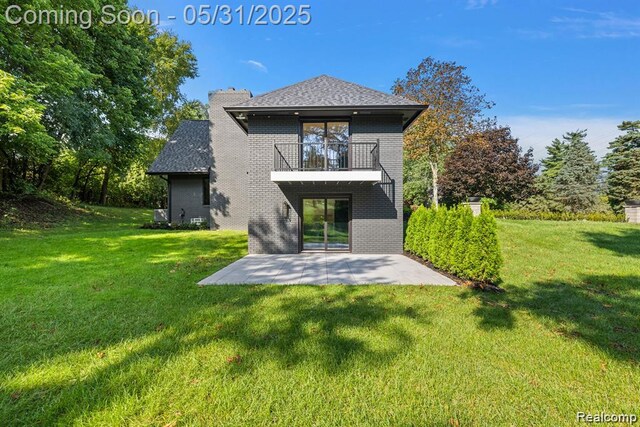 1367 W Long Lake Rd, Bloomfield Hills, MI 48302 - rear view of house featuring a balcony, a patio area, a lawn, and brick siding