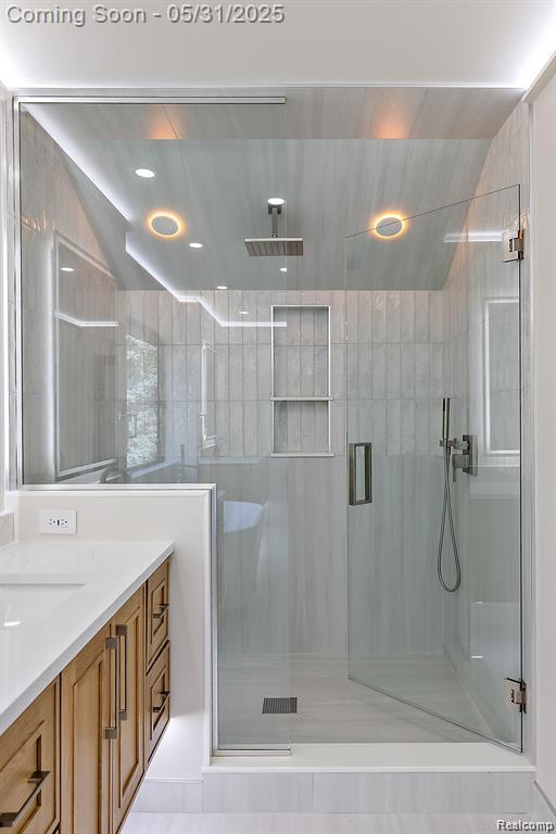 1367 W Long Lake Rd, Bloomfield Hills, MI 48302 - bathroom with a shower stall, vanity, and recessed lighting
