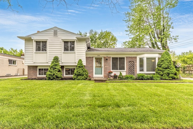 204 Meadowlake Rd, Canton, MI 48188 - split level home with brick siding and a front yard
