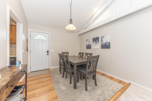204 Meadowlake Rd, Canton, MI 48188 - dining area with lofted ceiling, light wood-style floors, and baseboards