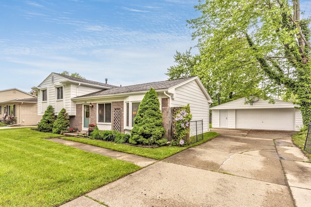 204 Meadowlake Rd, Canton, MI 48188 - tri-level home with a garage, an outdoor structure, a front lawn, and brick siding