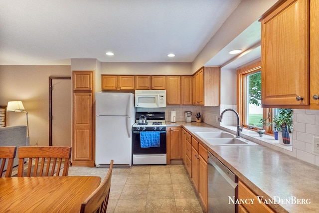 2857 Autumn Ct, Hudsonville, MI 49426 - kitchen featuring white appliances, a sink, decorative backsplash, light countertops, and recessed lighting