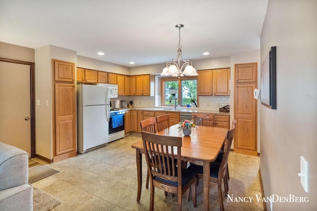 2857 Autumn Ct, Hudsonville, MI 49426 - kitchen featuring white appliances, a sink, tasteful backsplash, light countertops, and baseboards