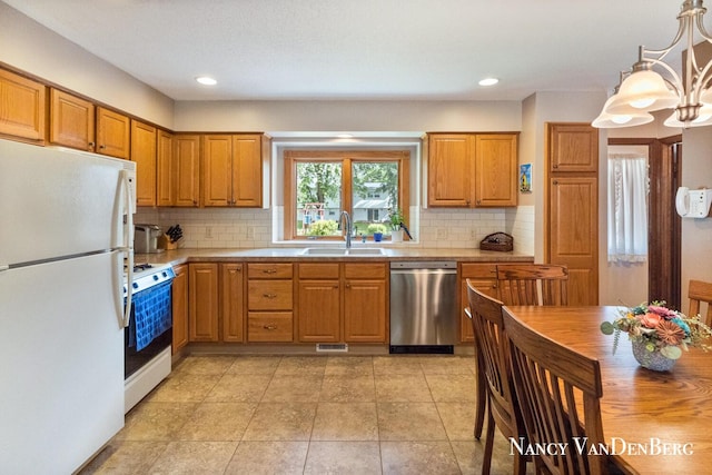 2857 Autumn Ct, Hudsonville, MI 49426 - kitchen with white appliances, a sink, light countertops, backsplash, and recessed lighting