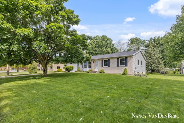 2857 Autumn Ct, Hudsonville, MI 49426 - view of front of house with a front yard and brick siding