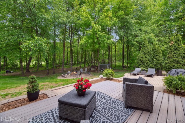 4298 Emu Dr, Pinckney, MI 48169 - wooden deck with an outdoor fire pit and a yard