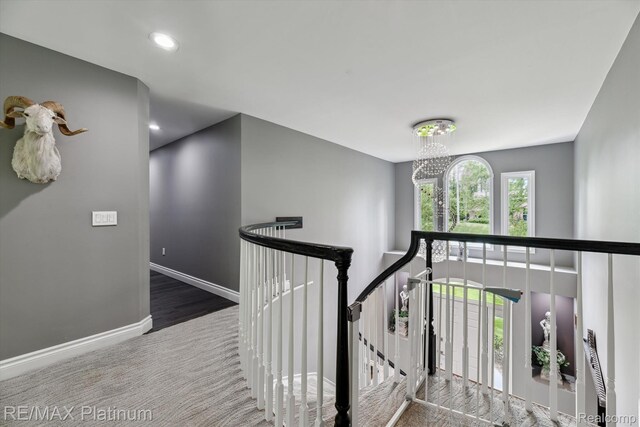 4298 Emu Dr, Pinckney, MI 48169 - stairs featuring baseboards, a chandelier, carpet, and recessed lighting