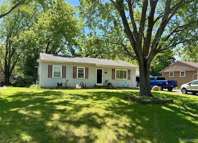 723 Los Arboles Dr, Wolverine Lake, MI 48390 - view of front of home featuring a front yard