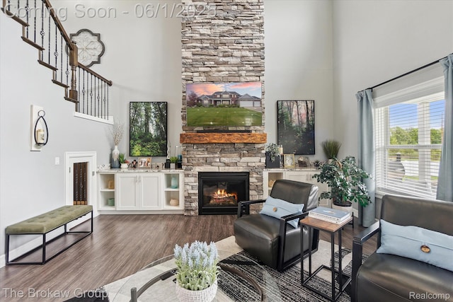 6268 Victoria Ln, Swartz Creek, MI 48473 - living area with a high ceiling, a fireplace, and dark wood finished floors