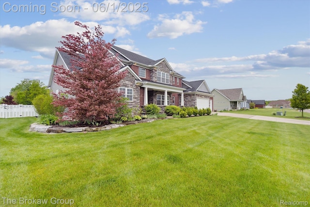 6268 Victoria Ln, Swartz Creek, MI 48473 - view of front of property featuring stone siding, driveway, and an attached garage