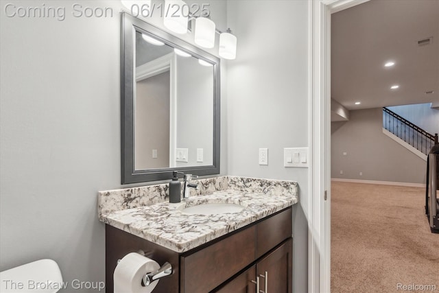 6268 Victoria Ln, Swartz Creek, MI 48473 - half bathroom with vanity, toilet, recessed lighting, and baseboards