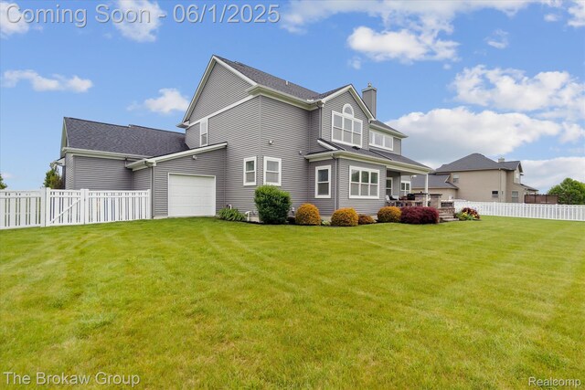 6268 Victoria Ln, Swartz Creek, MI 48473 - rear view of property featuring a chimney and a garage