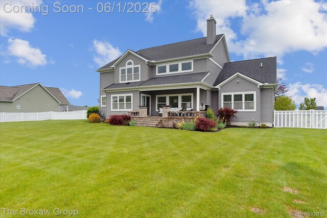 6268 Victoria Ln, Swartz Creek, MI 48473 - back of house with a chimney and covered porch