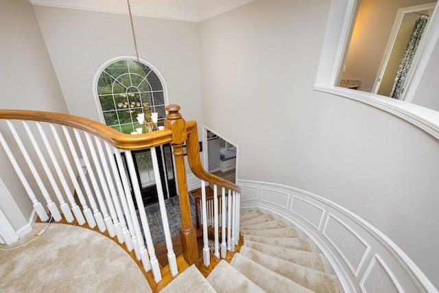 50550 W Fellows Creek Ct, Plymouth, MI 48170 - stairs featuring a chandelier, carpet flooring, a high ceiling, a wall mounted AC, and crown molding